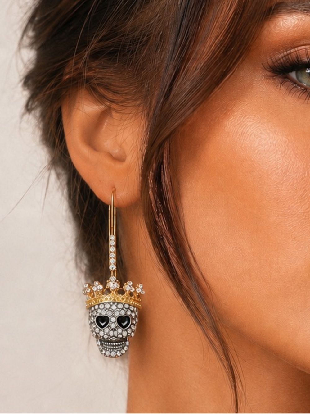 Gold-Tone Crowned Skull Drop Earrings with Black Heart Eyes